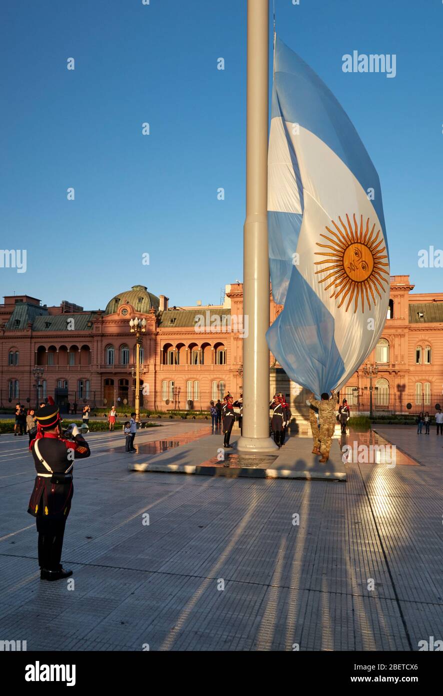Soldiers taking down the argentina flag, at May Square (Plaza de Mayo) Buenos Aires, Argentina. Stock Photo
