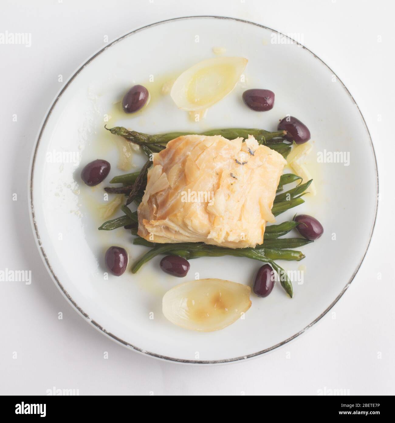 Boiled Code Fish Meal of Boiled Cod Fish with black olives and green beans Stock Photo ...