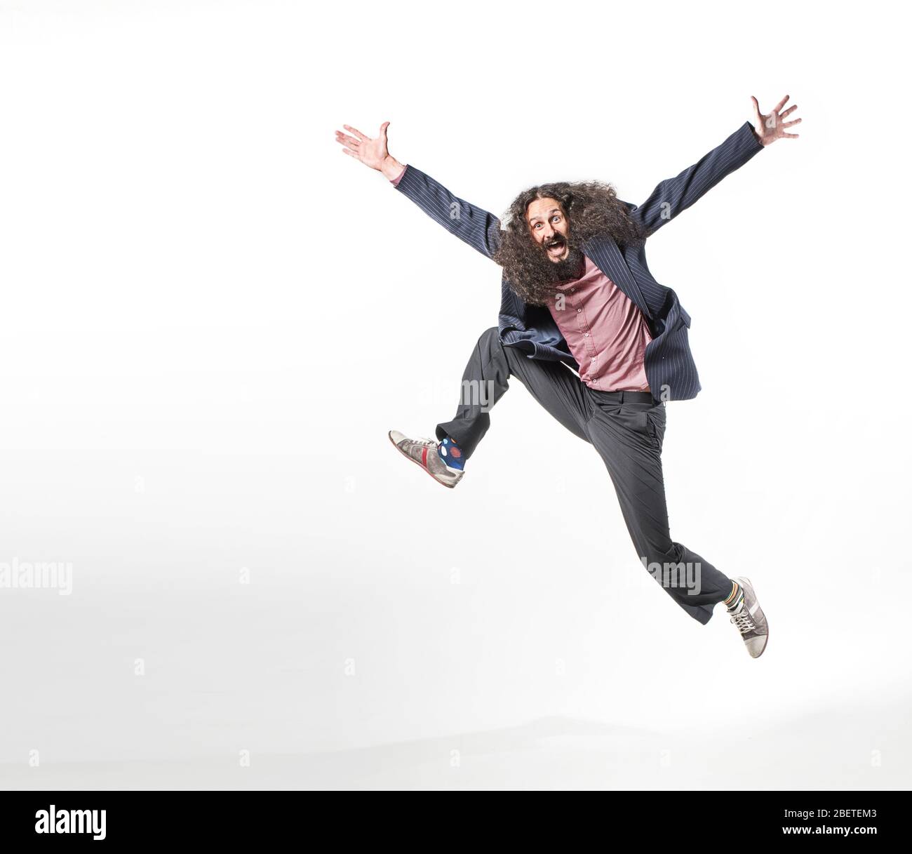 Portrait of an odd jumping guy Stock Photo