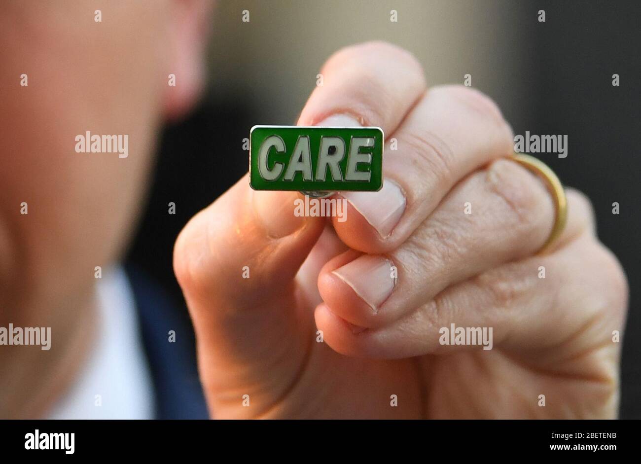 Health Secretary Matt Hancock showing the new 'Care' badge, described as a 'badge of honour' for social care workers so they can get the same public recognition as NHS staff, in Downing Street, London. Stock Photo