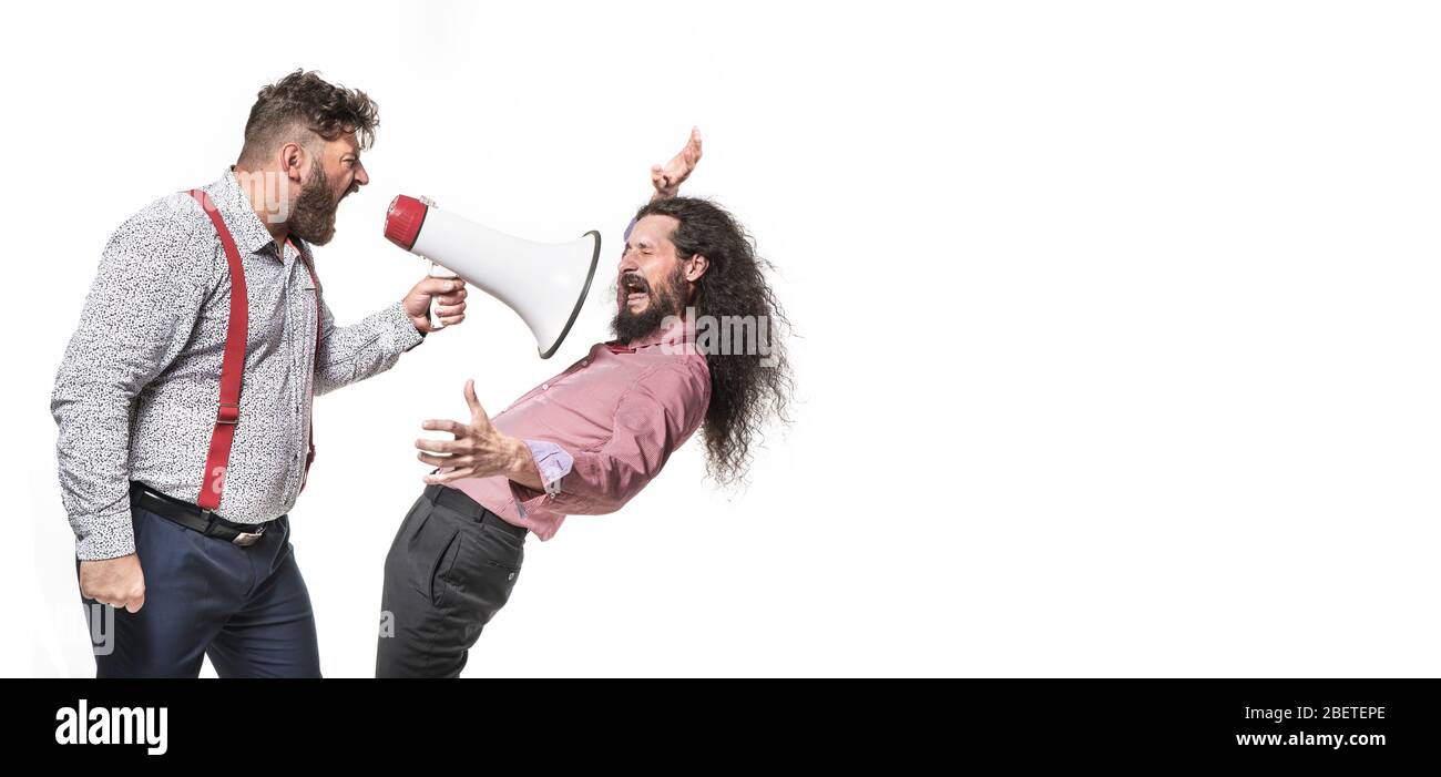 Plump, angry boss yelling at the employee Stock Photo
