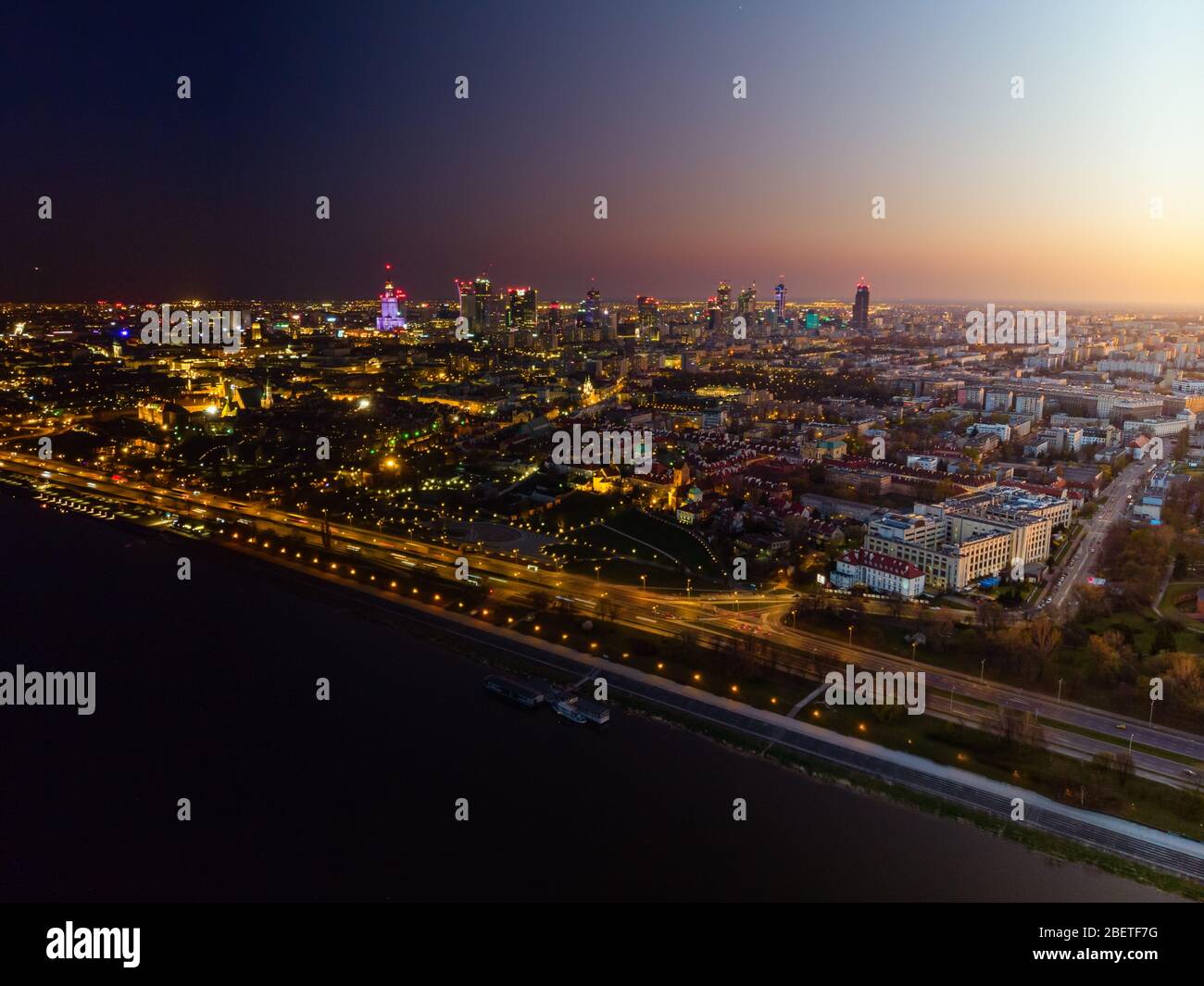 Warsaw city center at dusk aerial view, day into night transformation ...