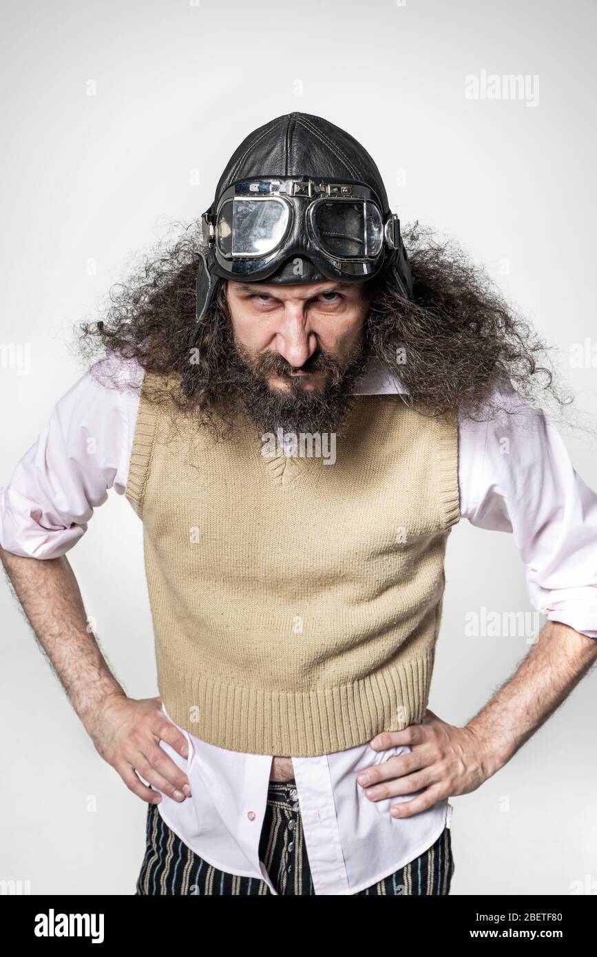Funny portrait of a nerdy man wearing a pilot goggles Stock Photo