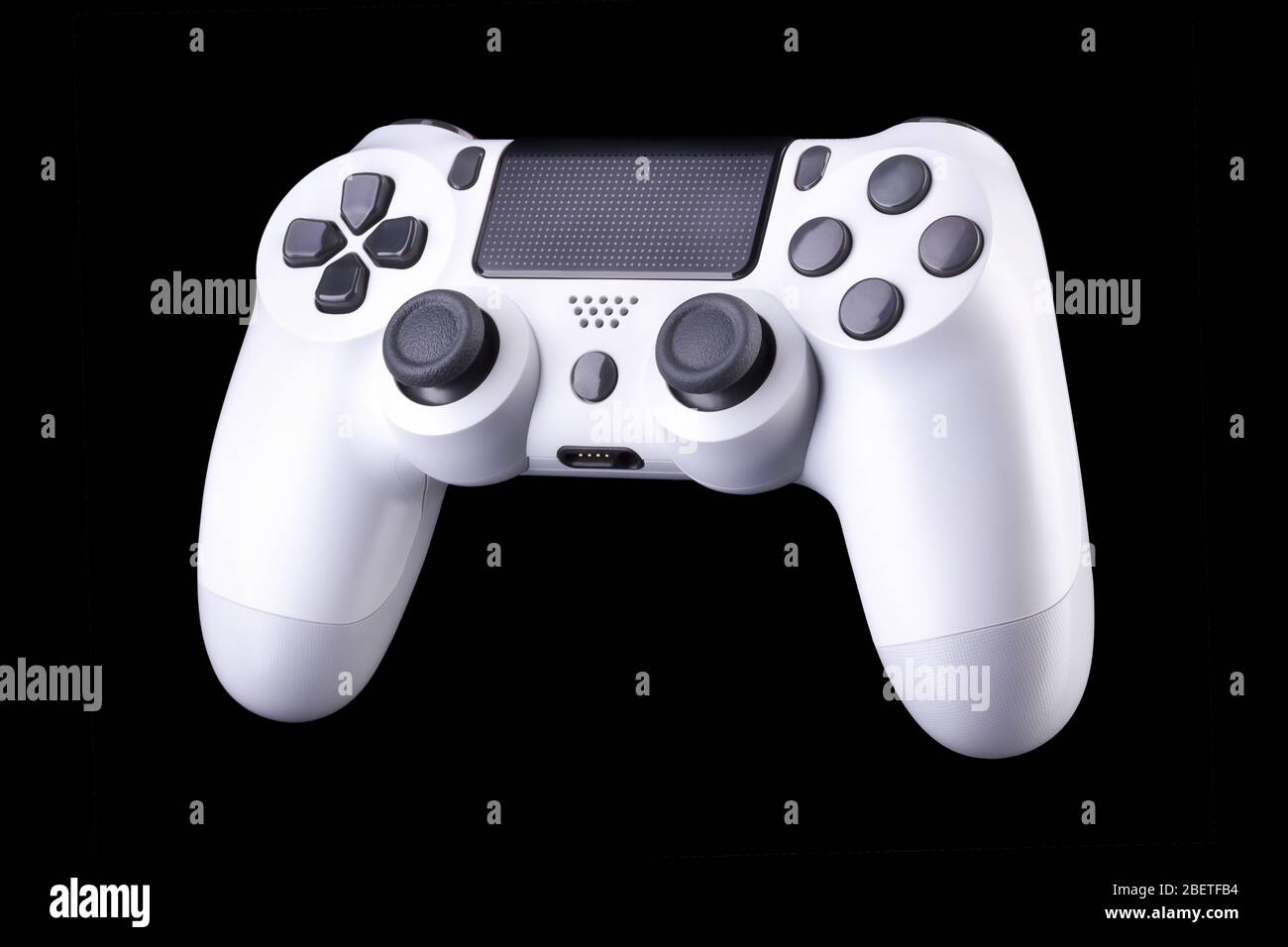 White video game joystick gamepad isolated on a black background Stock ...