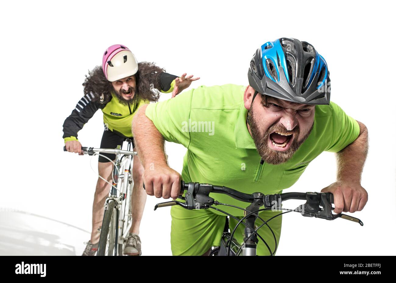 Plump and skinny geeks riding bicycles Stock Photo