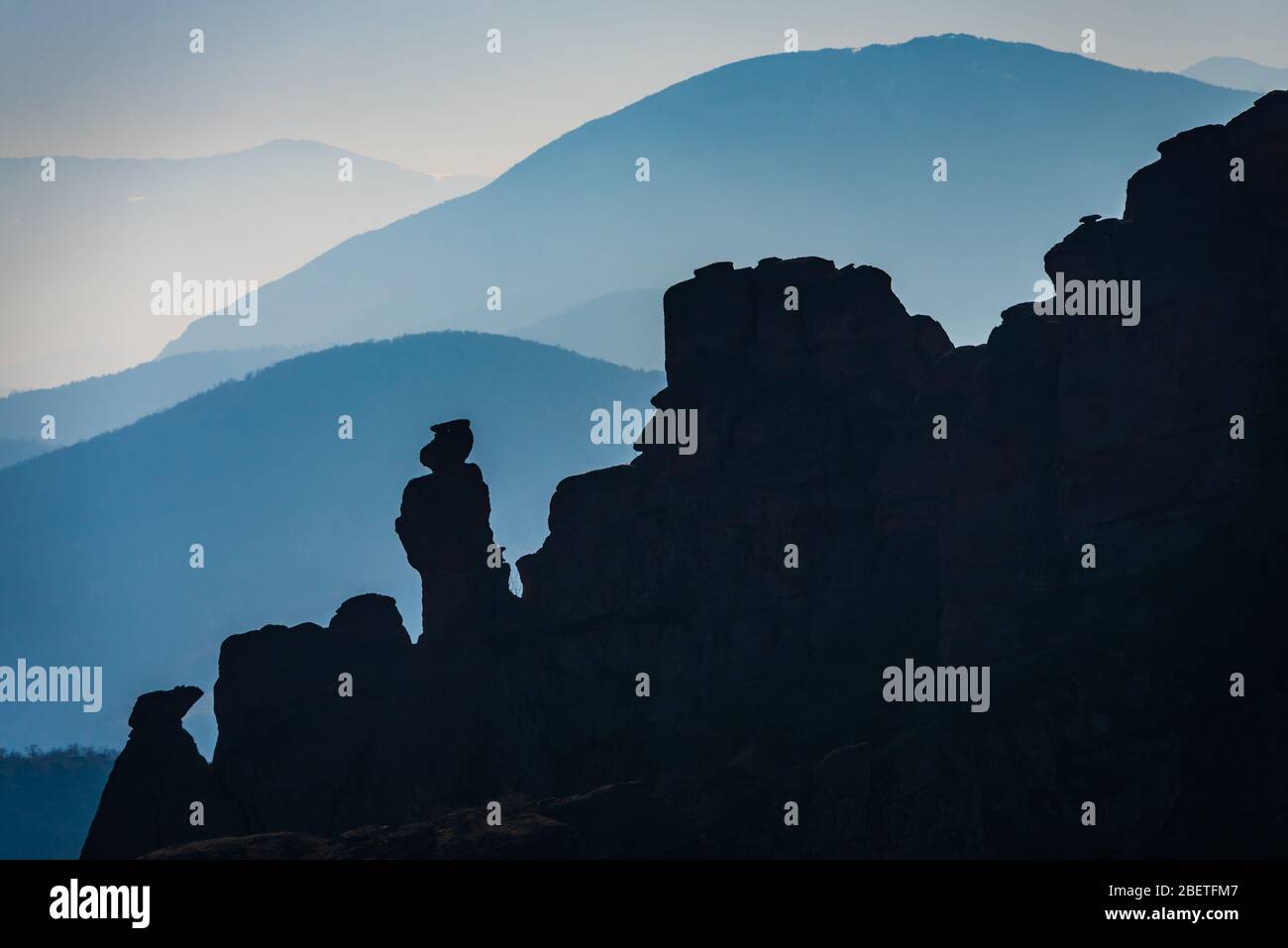 Incredible silhouettes of the oddly shaped sandstone rock formations in the historical town of Belogradchik, Northwestern Bulgaria Stock Photo