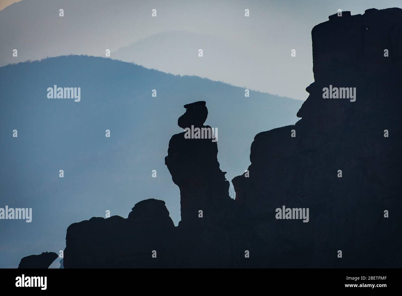 Incredible silhouettes of the oddly shaped sandstone rock formations in the historical town of Belogradchik, Northwestern Bulgaria Stock Photo