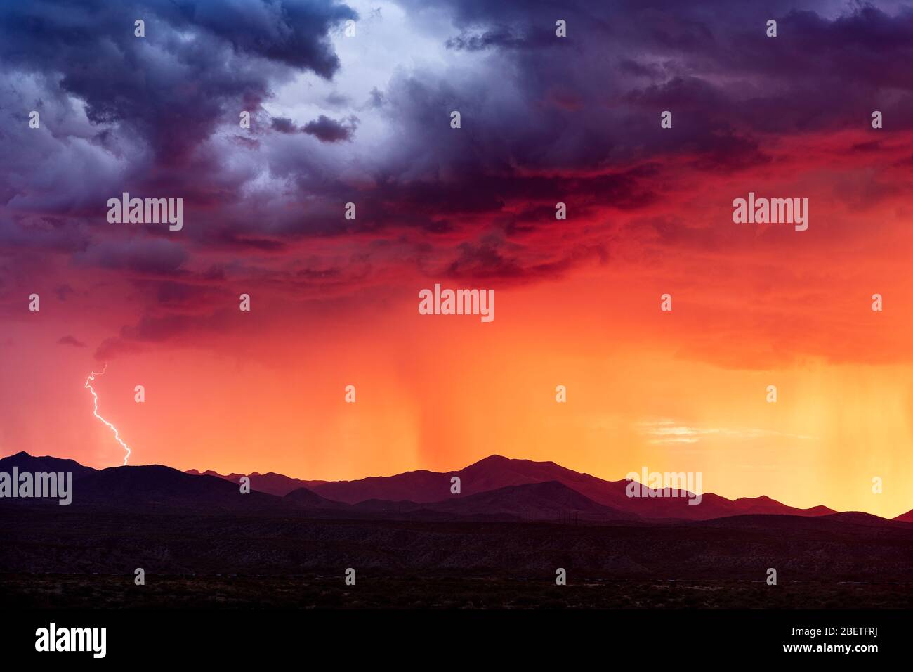 Lightning strikes from a monsoon storm at sunset near Tucson, Arizona