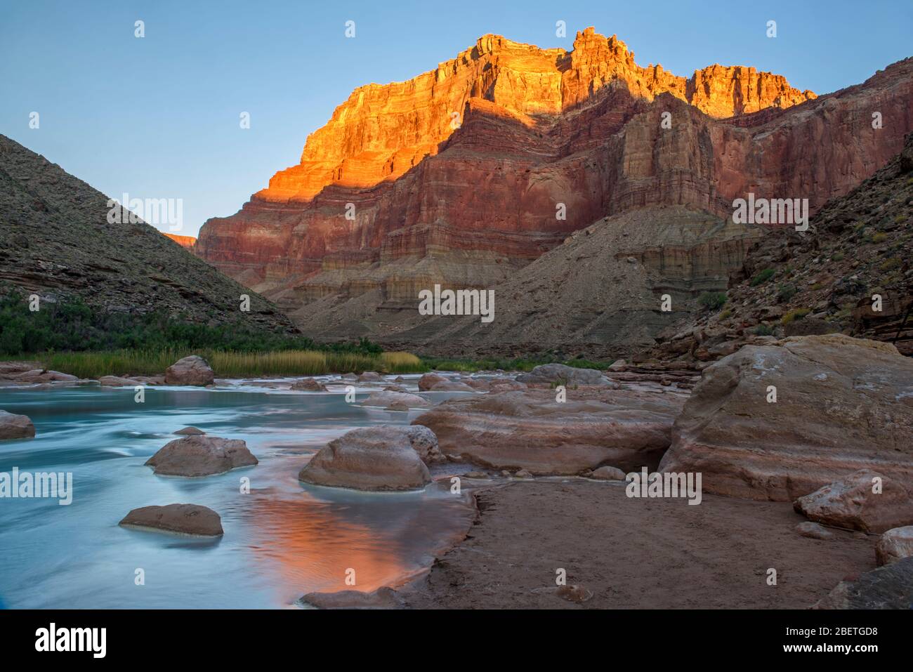 Little Colorado River- mineral-laden water with canyon wall reflections at dawn, Grand Canyon National Park, Arizona, USA Stock Photo