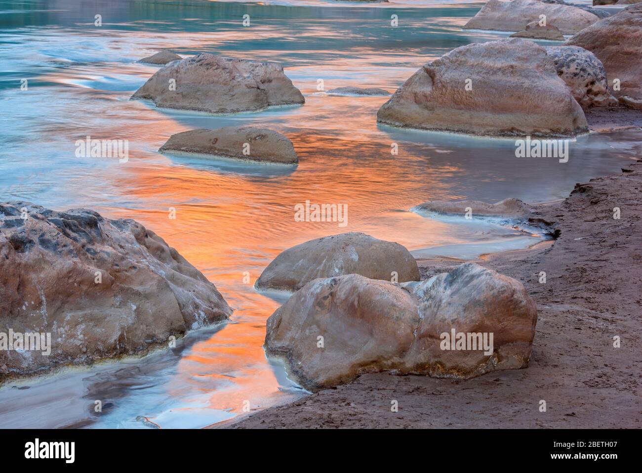 Little Colorado River- mineral-laden water with canyon wall reflections at dawn, Grand Canyon National Park, Arizona, USA Stock Photo