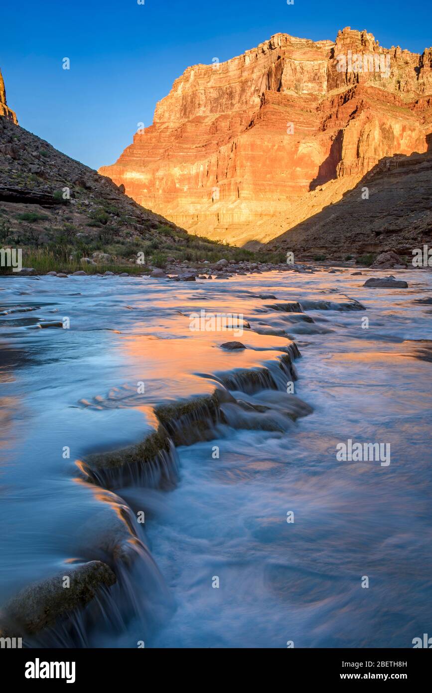 Little Colorado River- mineral-laden water flowing over travertine terraces at dawn, Grand Canyon National Park, Arizona, USA Stock Photo