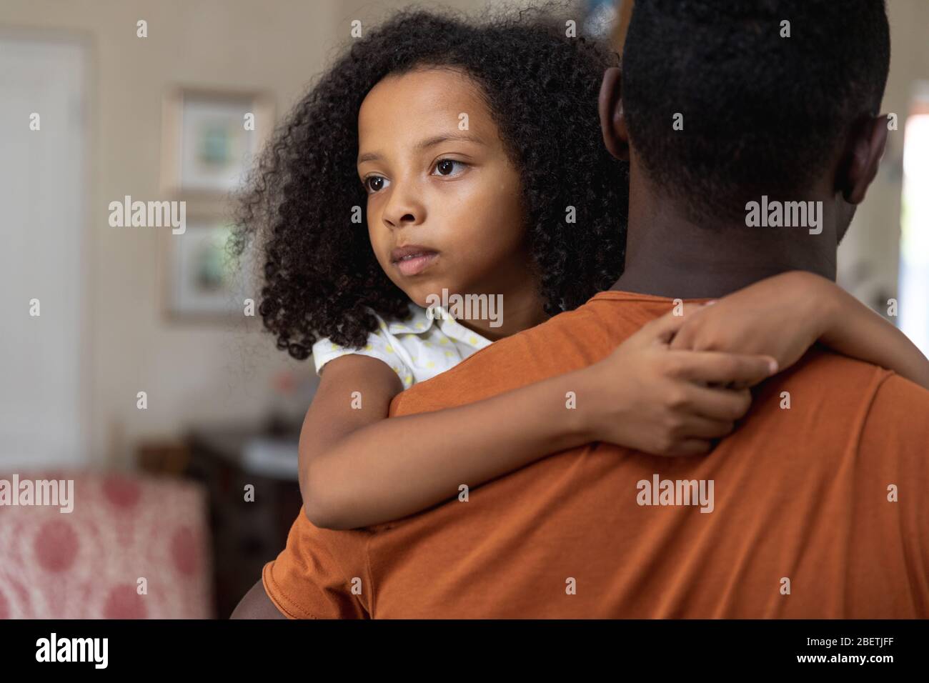 Father and Daughter social distancing at home during quarantine lockdown Stock Photo