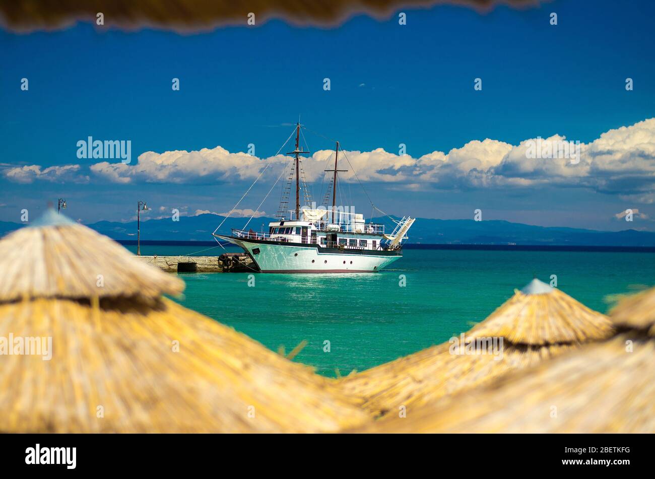 View of ship boat on blue paradise water of Toroneos kolpos gulf, blue