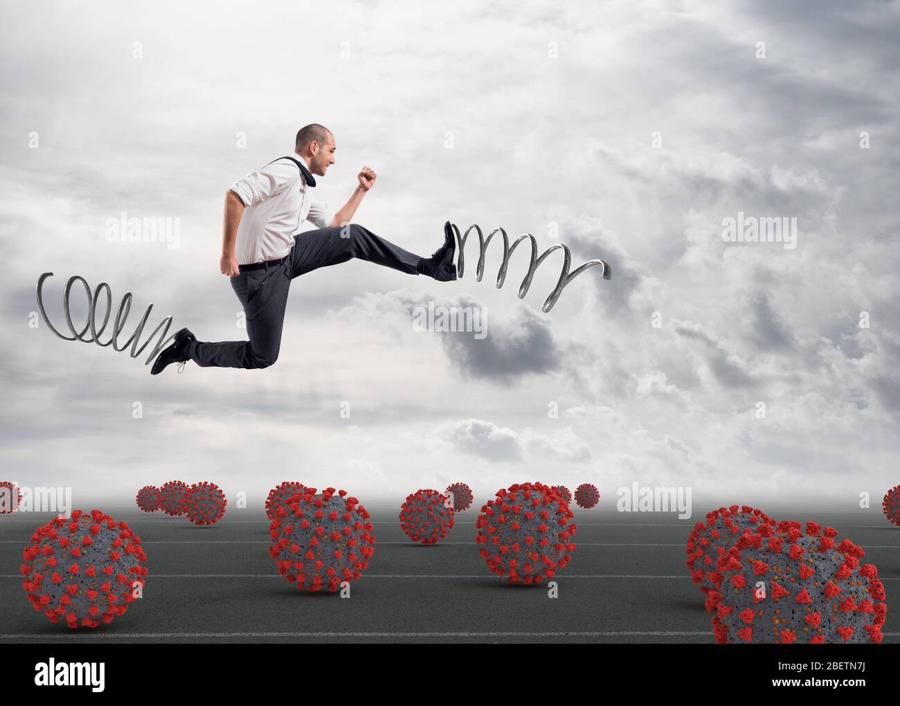Man runs among viruses, avoiding contagion, with springs on his feet to go to work Stock Photo