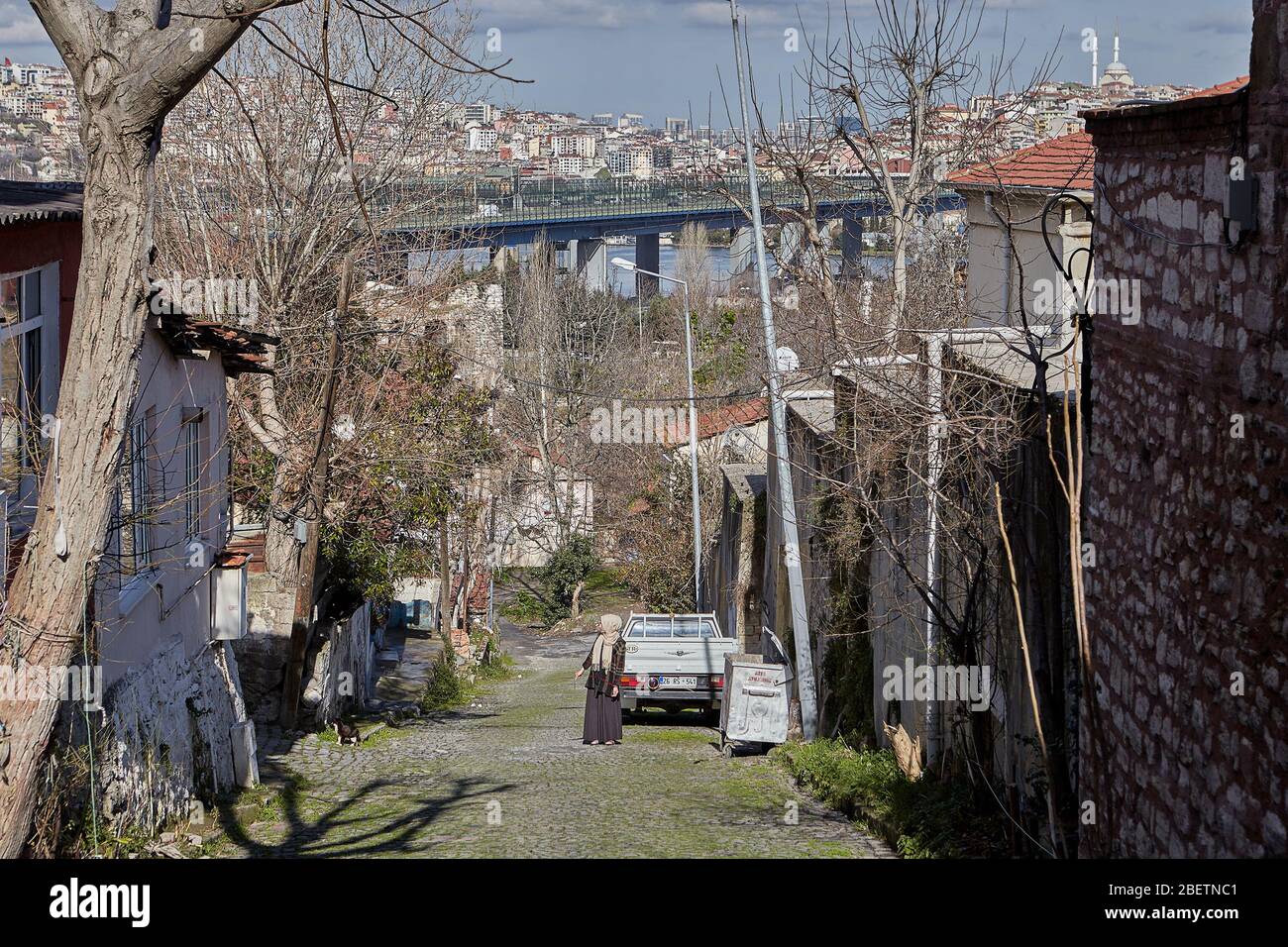 Istanbul, Turkey - February 12, 2020: The residential quarter of Ayvansaray neighborhood in Fatih district, and the Halic Bridge in the background. Stock Photo