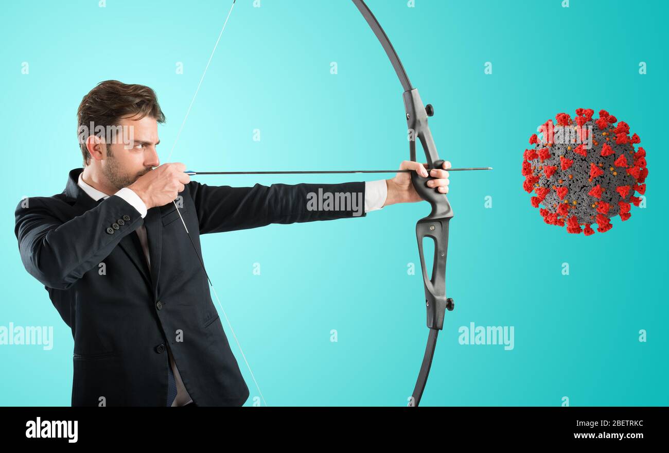 Man want to destroy the covid-19 coronavirus with bow and arrow Stock Photo