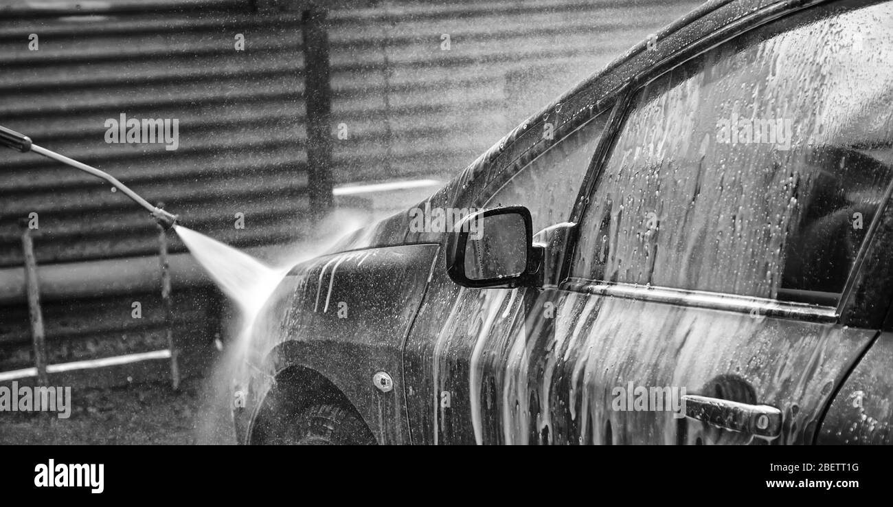 Car in industrial car wash, hygiene and cleaning of vehicles Stock Photo