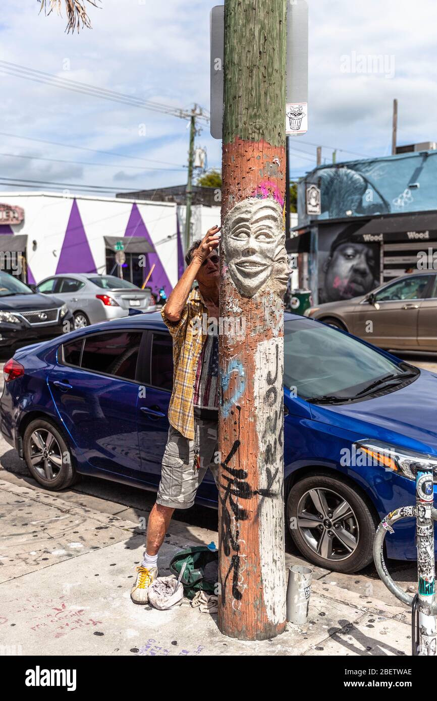 A street artist at work, the Wynwood Art District, Miami, Florida, USA. Stock Photo