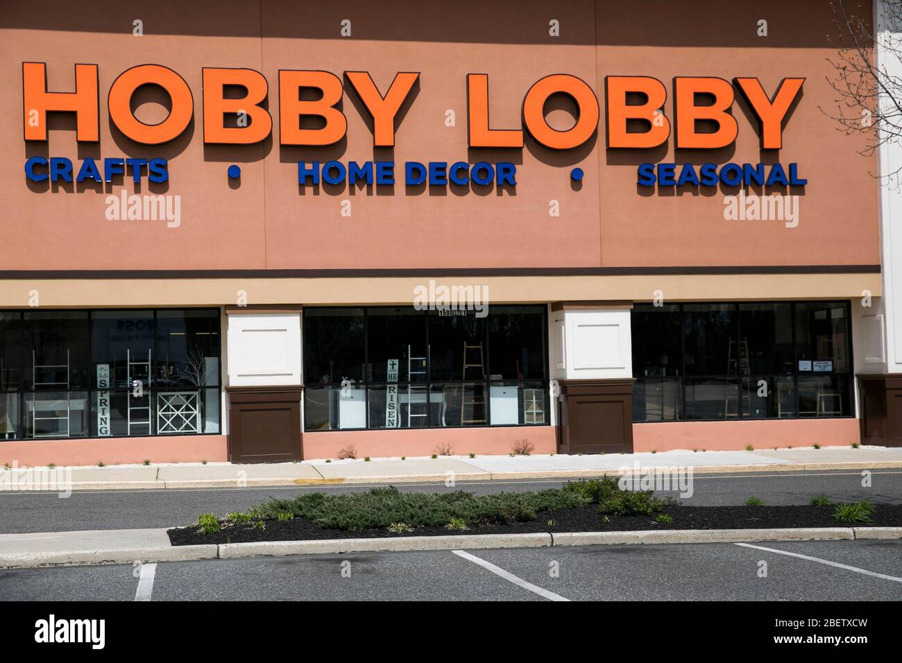 A logo sign outside of a Hobby Lobby retail store location in Deptford Township, New Jersey on