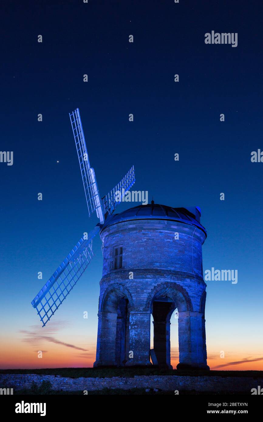 Chesterton, Warwickshire, UK. 15th Apr, 2020. The 17th century Grade 1 listed windmill at Chesterton, near Leamington Spa, Warwickshire, is illuminated with blue light in support of the NHS and other key workers. Credit: Peter Lopeman/Alamy Live News Stock Photo