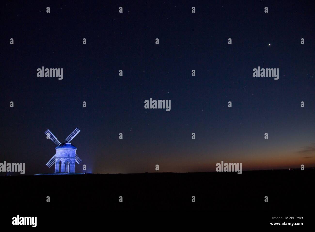 Chesterton, Warwickshire, UK. 15th Apr, 2020. The 17th century Grade 1 listed windmill at Chesterton, near Leamington Spa, Warwickshire, is illuminated with blue light in support of the NHS and other key workers. Credit: Peter Lopeman/Alamy Live News Stock Photo