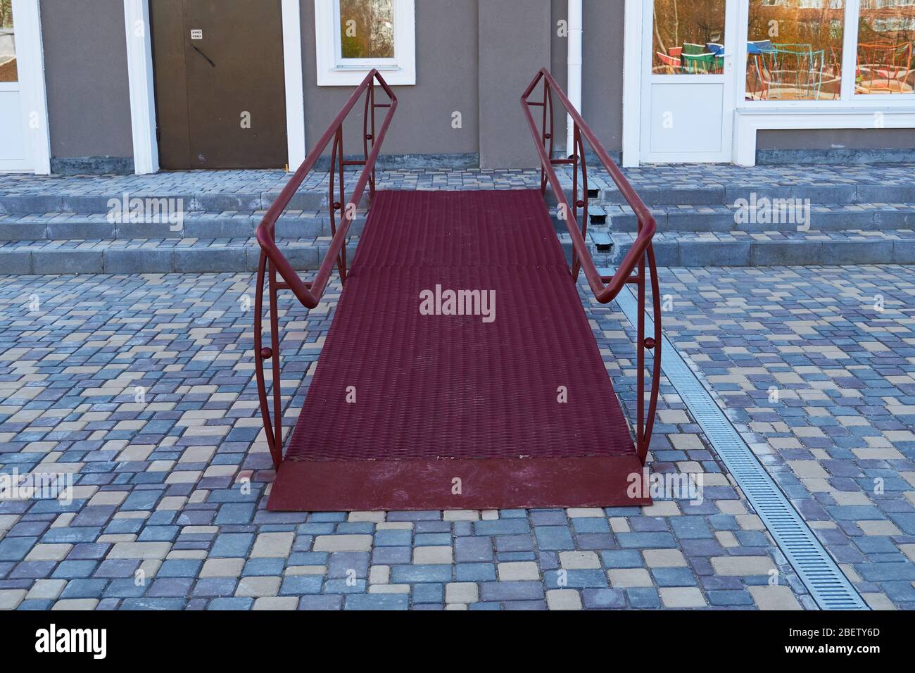 Wheelchair access ramp for entrance of residential multistory building