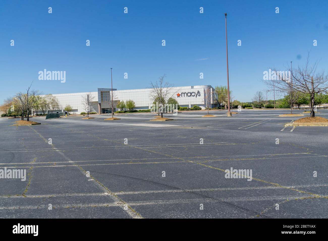 Kennesaw, GA / USA - 04/03/20: Macy's department store empty parking lots - shut down and furloughed employees at Cobb county Town Center mall - econo Stock Photo
