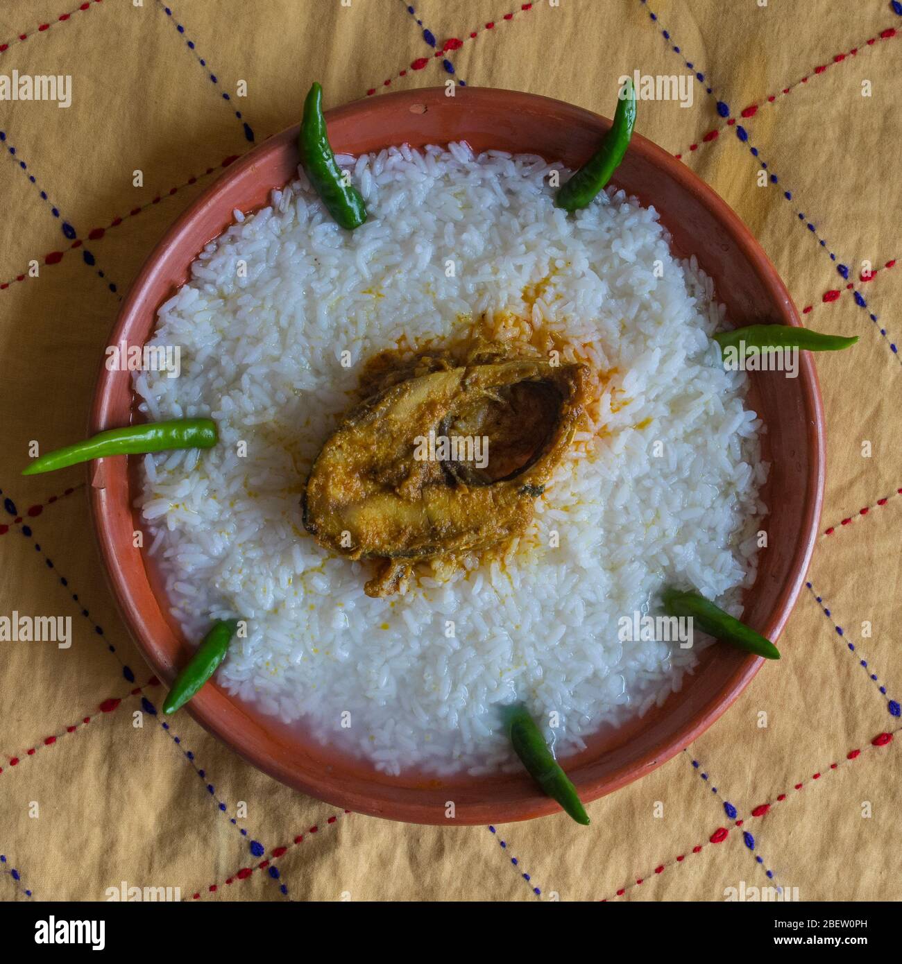 Traditional Bengali foods on earthen plate named Panta Ilish and Alu Vorta Stock Photo