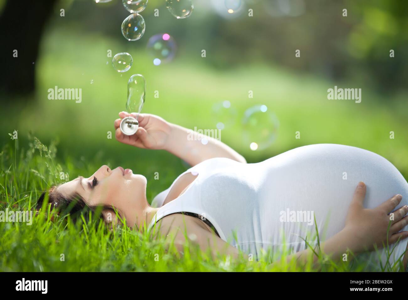Pregnant woman in nature Stock Photo - Alamy