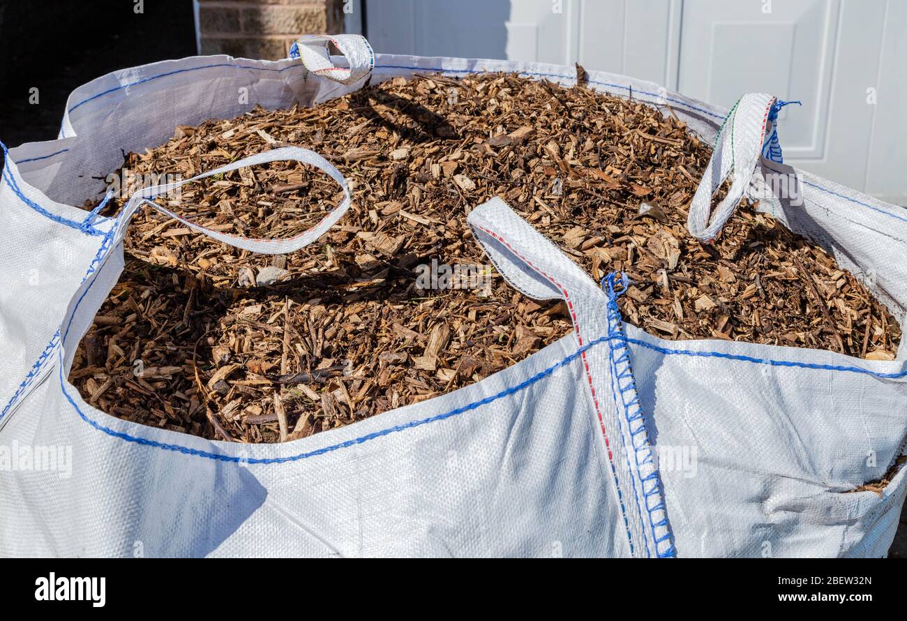 A large bag of bark chippings for garden mulching. Stock Photo