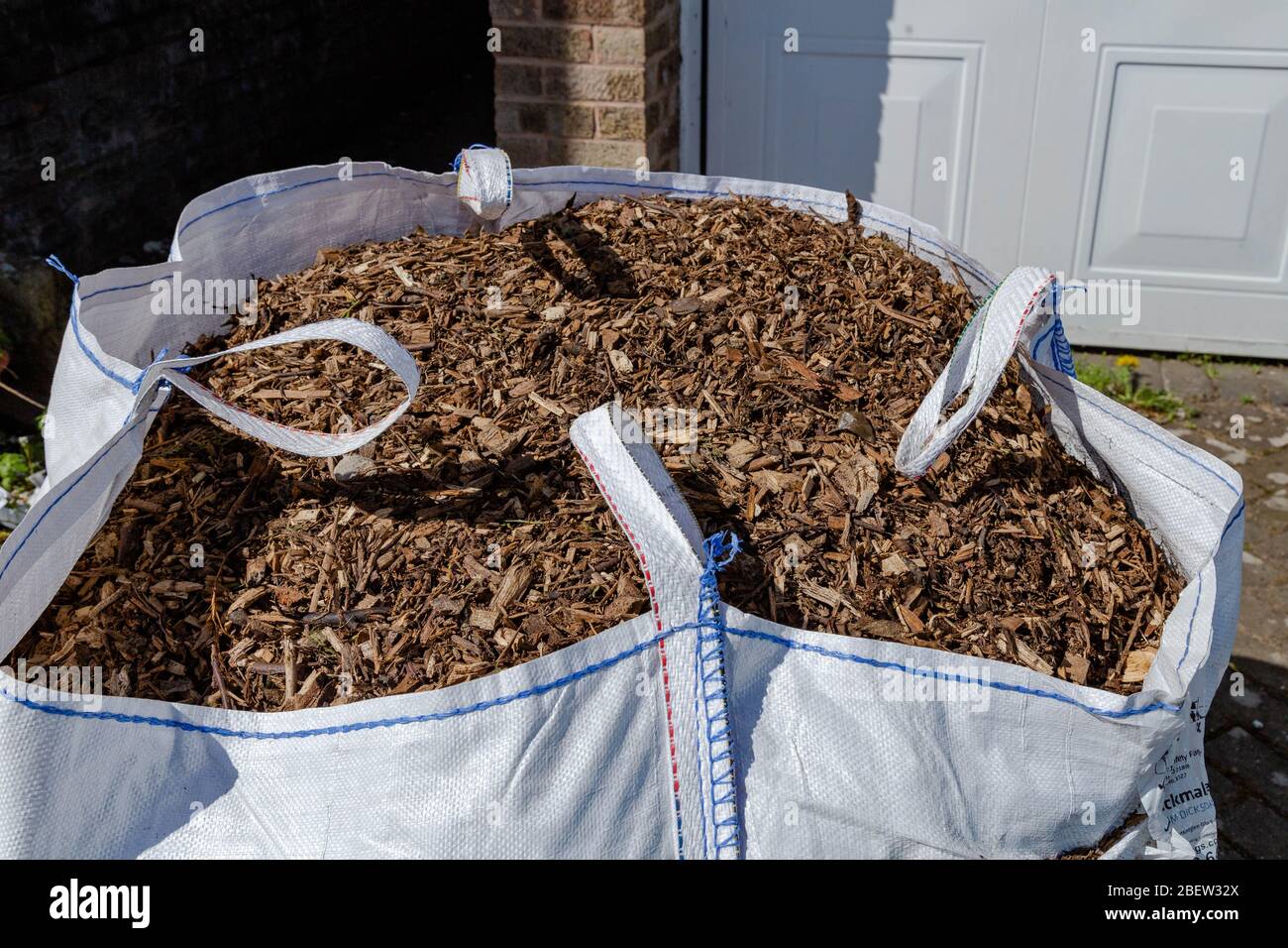 A large bag of bark chippings for garden mulching. Stock Photo