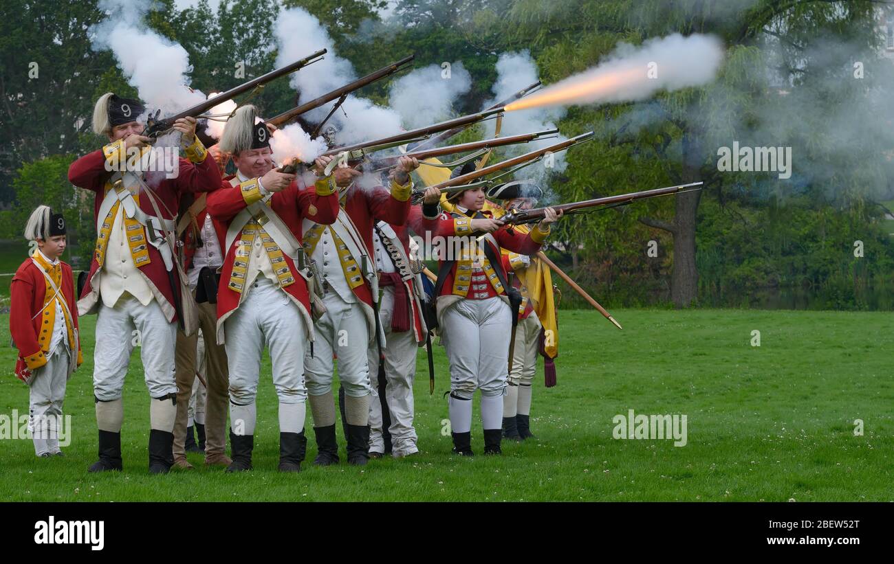 Reenactment of American Revolutionary War with guns fired and smoke from the guns. Stock Photo