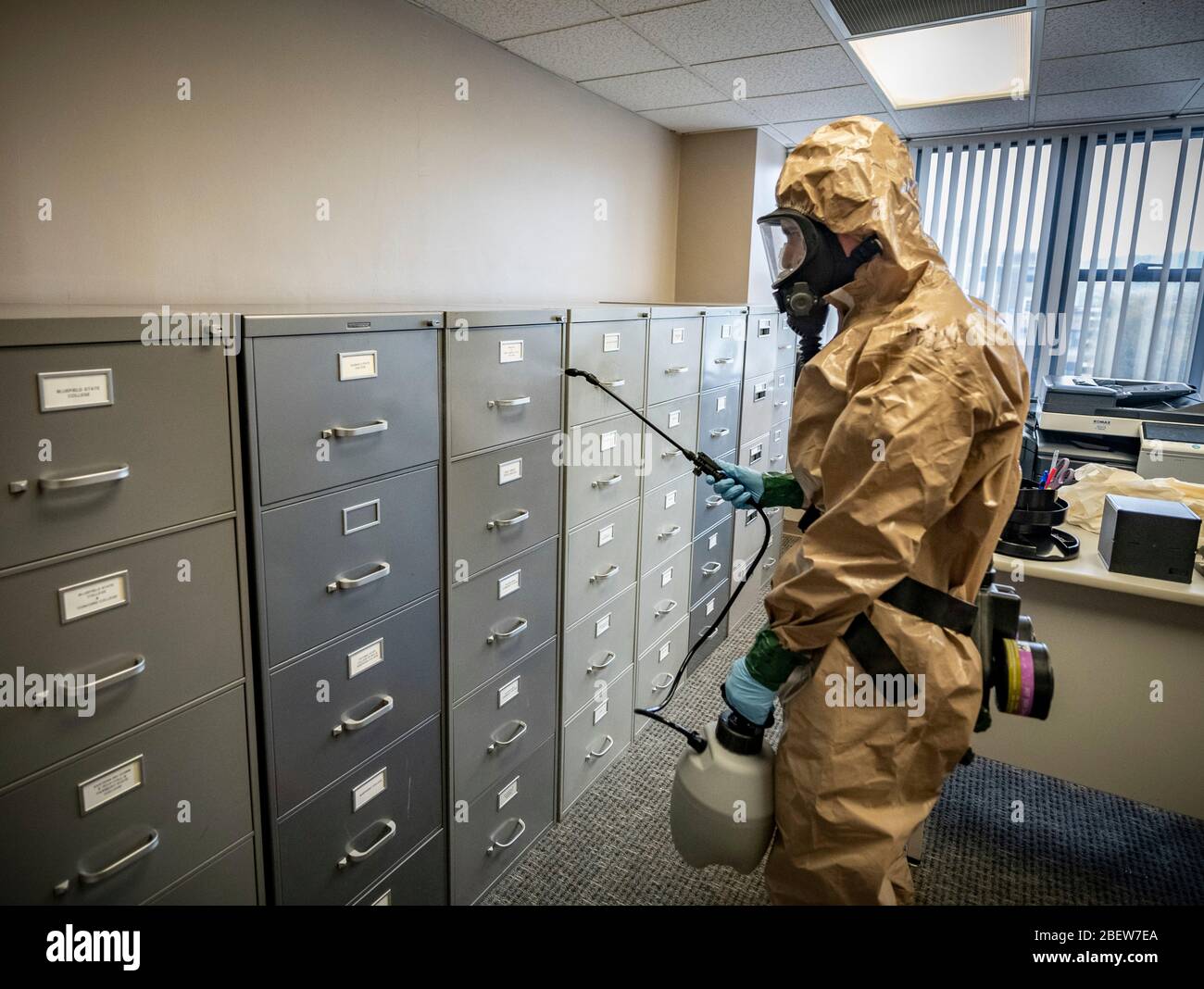 West Virginia National Guard soldiers sanitize workspaces for the West Virginia Higher Education Policy Commission from COVID-19, coronavirus April 11, 2020 in Charleston, West Virginia. Stock Photo