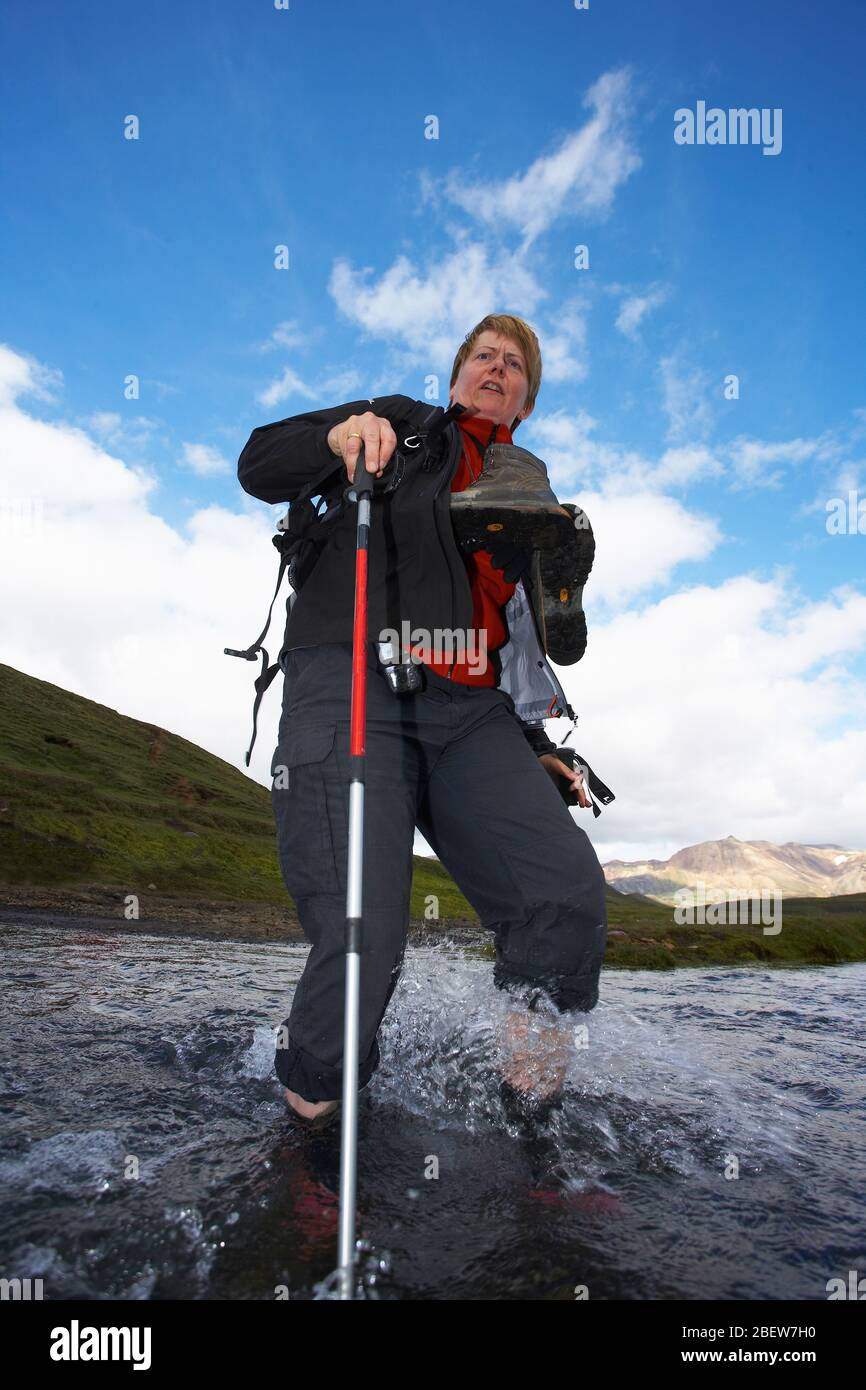 Mature woman hiking on trail hi-res stock photography and images - Alamy