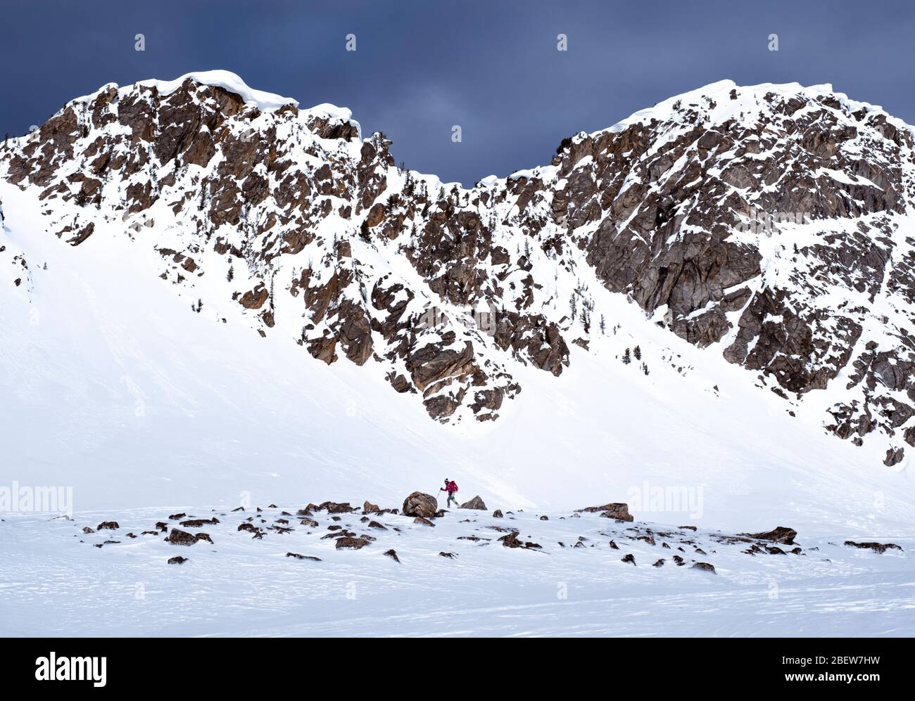 Woman hiking in snowy mountains hi-res stock photography and images - Alamy