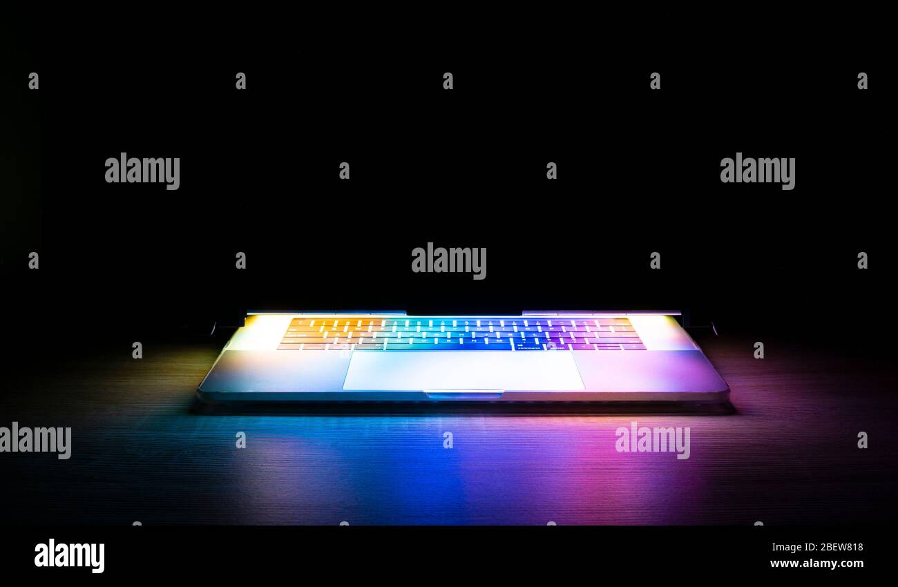 Modern Laptop Computer Isolated No Screen On Black Background With  Beautiful Colorful Light Stock Photo - Alamy