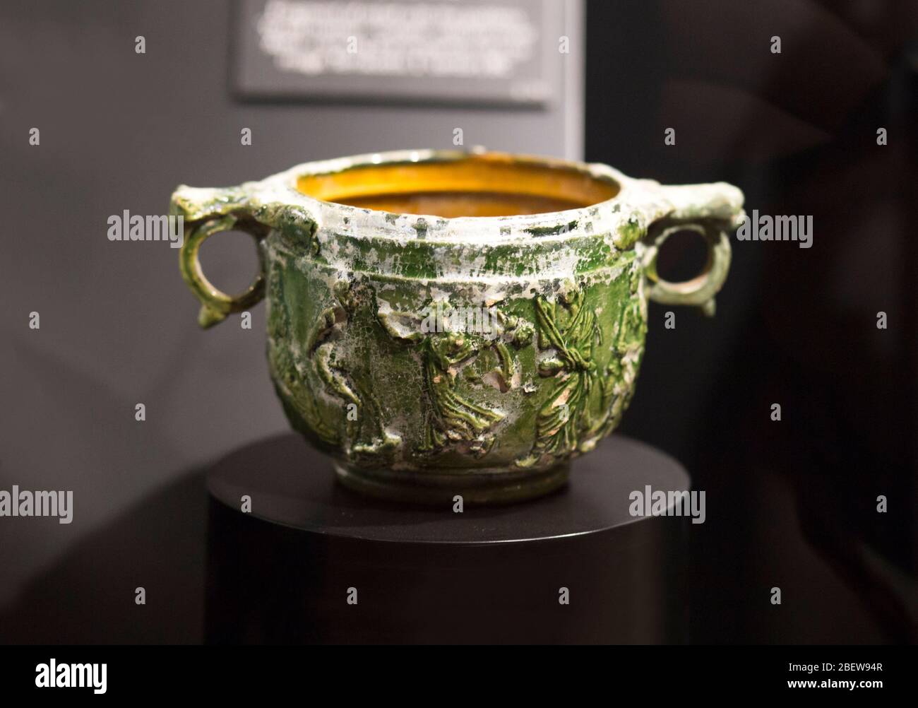 Malaga, Spain - March 2nd, 2019: Roman glazed ceramic skyphos pot or two-handled deep wine-cup, type glaux. Ifergan Collection Stock Photo