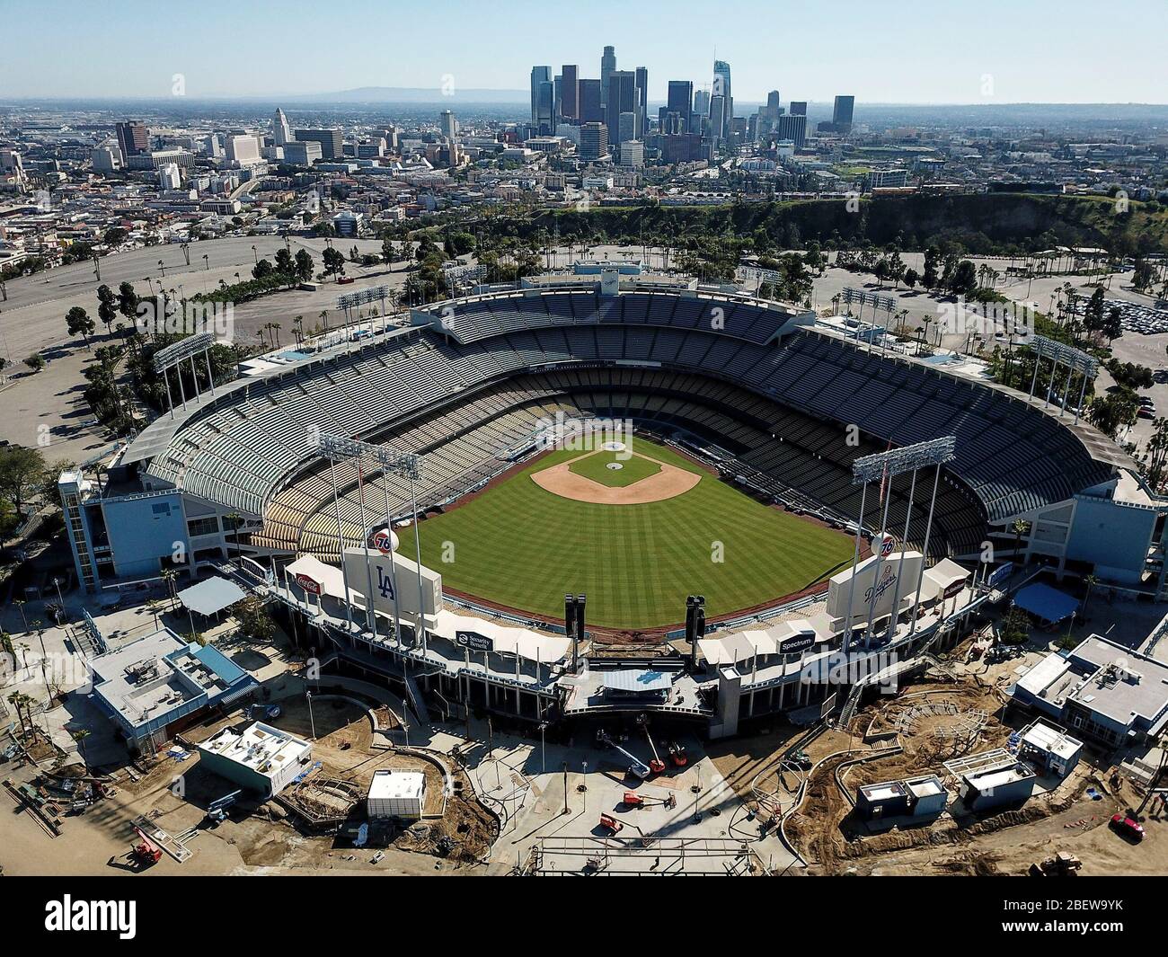 Los Angeles, California, USA. 15th Apr, 2020. An aerial view shows the Los Angeles Dodgers Stadium with downtown Los Angeles skyline in background on April 15, 2020. Los Angeles Mayor Eric Garcetti said today he doesn't foresee large gatherings, such as sporting events and concerts, happening in the city until 2021, as the region continues to reel from the COVID-19 pandemic. Credit: Ringo Chiu/ZUMA Wire/Alamy Live News Stock Photo