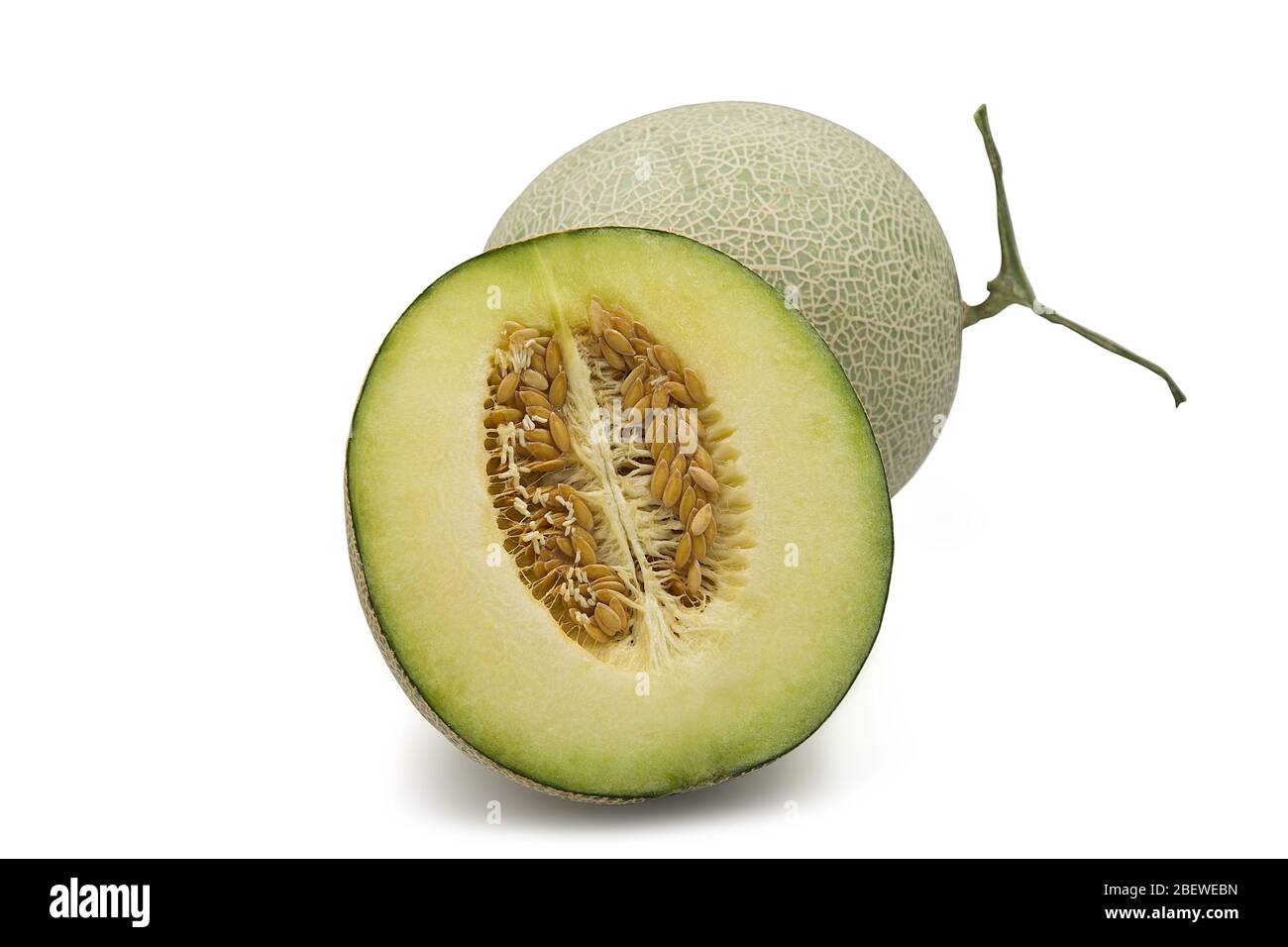 Organic japanese honeydew melon and a half on white isolated background