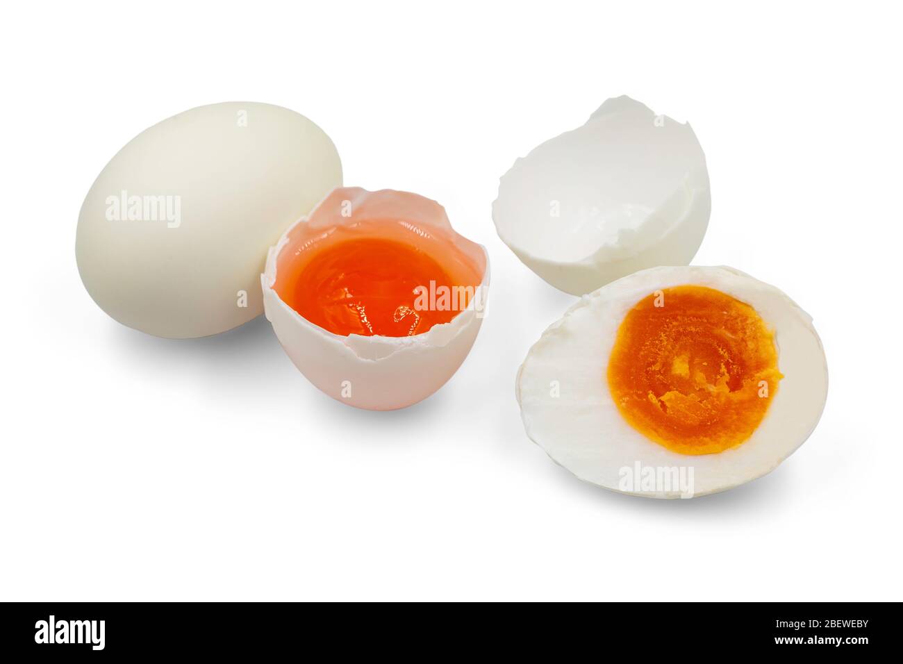 Organic raw and boiled salted egg on white isolated background with clipping path. Salted duck egg is popular Thai food so delicious with salty and cr Stock Photo