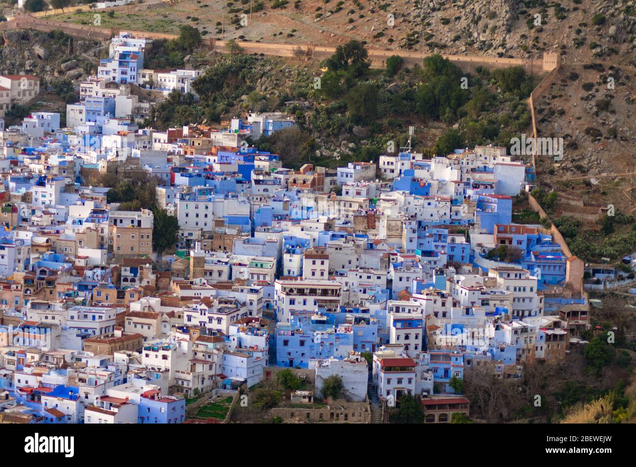 Skyline of Chefchaouen Morocco surrounded by the Old City Walls Stock Photo