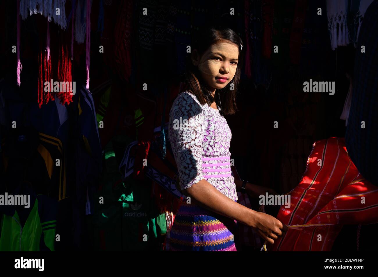 Young Burmese woman vending at the Central Market, Pathein, Myanmar Stock Photo