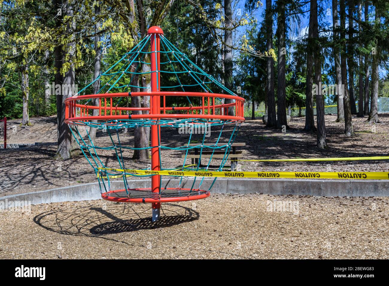 BELLEVUE, WA/USA – APRIL 15, 2020: Wilburton Hill Park, playground equipment closed with caution tape due to COVID 19 Stock Photo