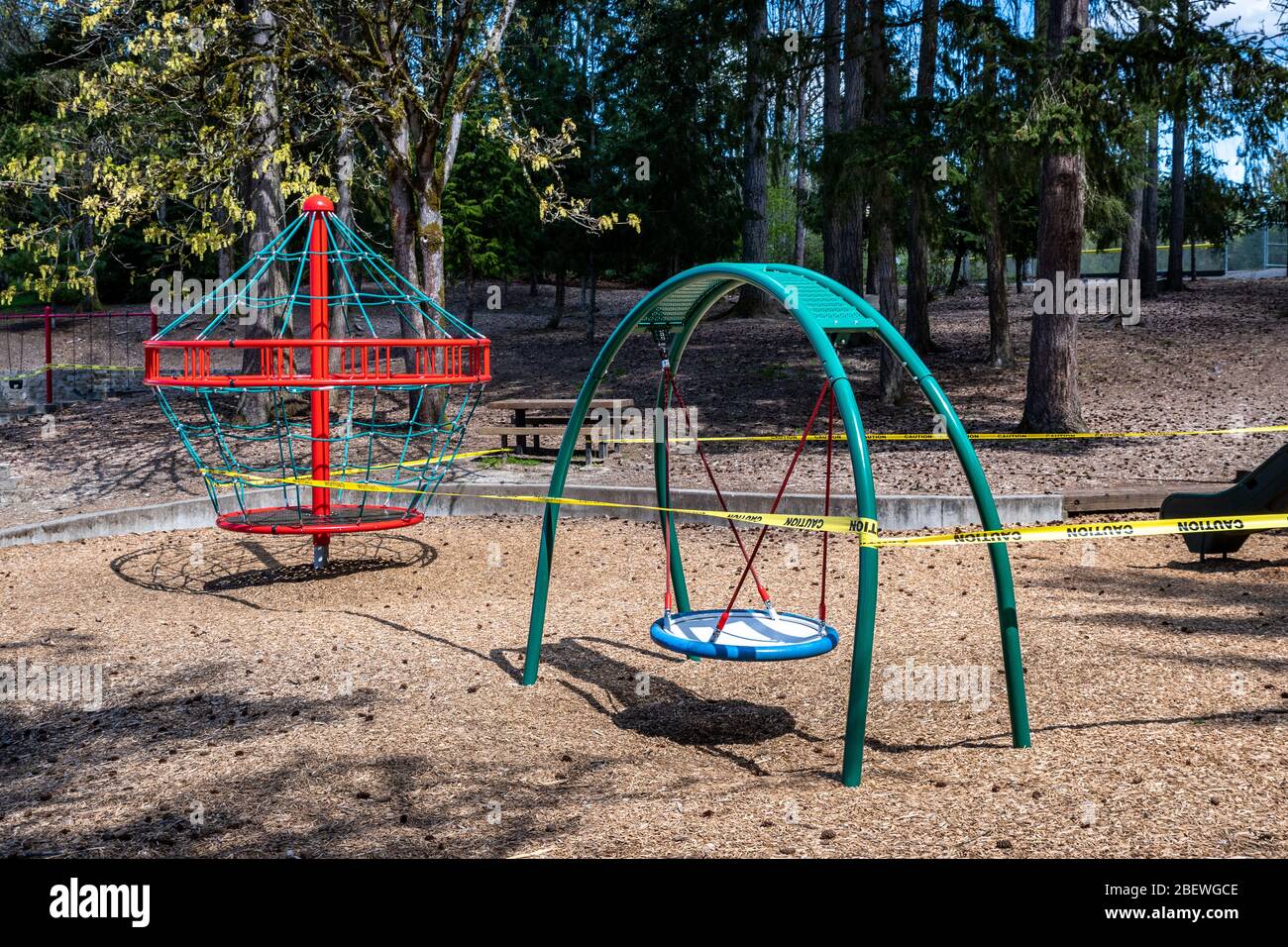 BELLEVUE, WA/USA – APRIL 15, 2020: Wilburton Hill Park, playground equipment closed with caution tape due to COVID 19 Stock Photo