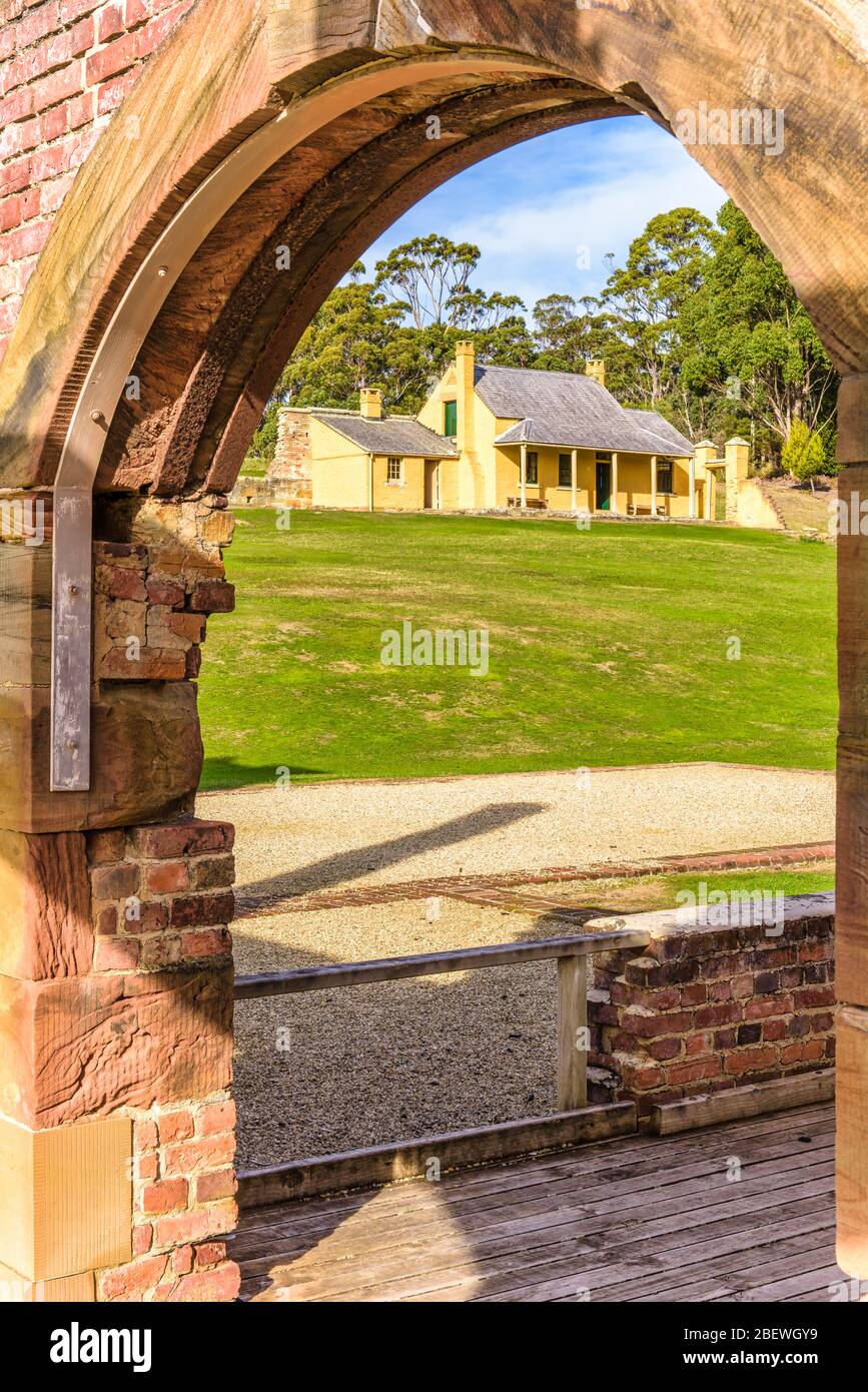 Smith O'Brian's Cottage viewed from the archway of the hospital at Port Arthur historic penal colony settlement in Tasmania. Stock Photo
