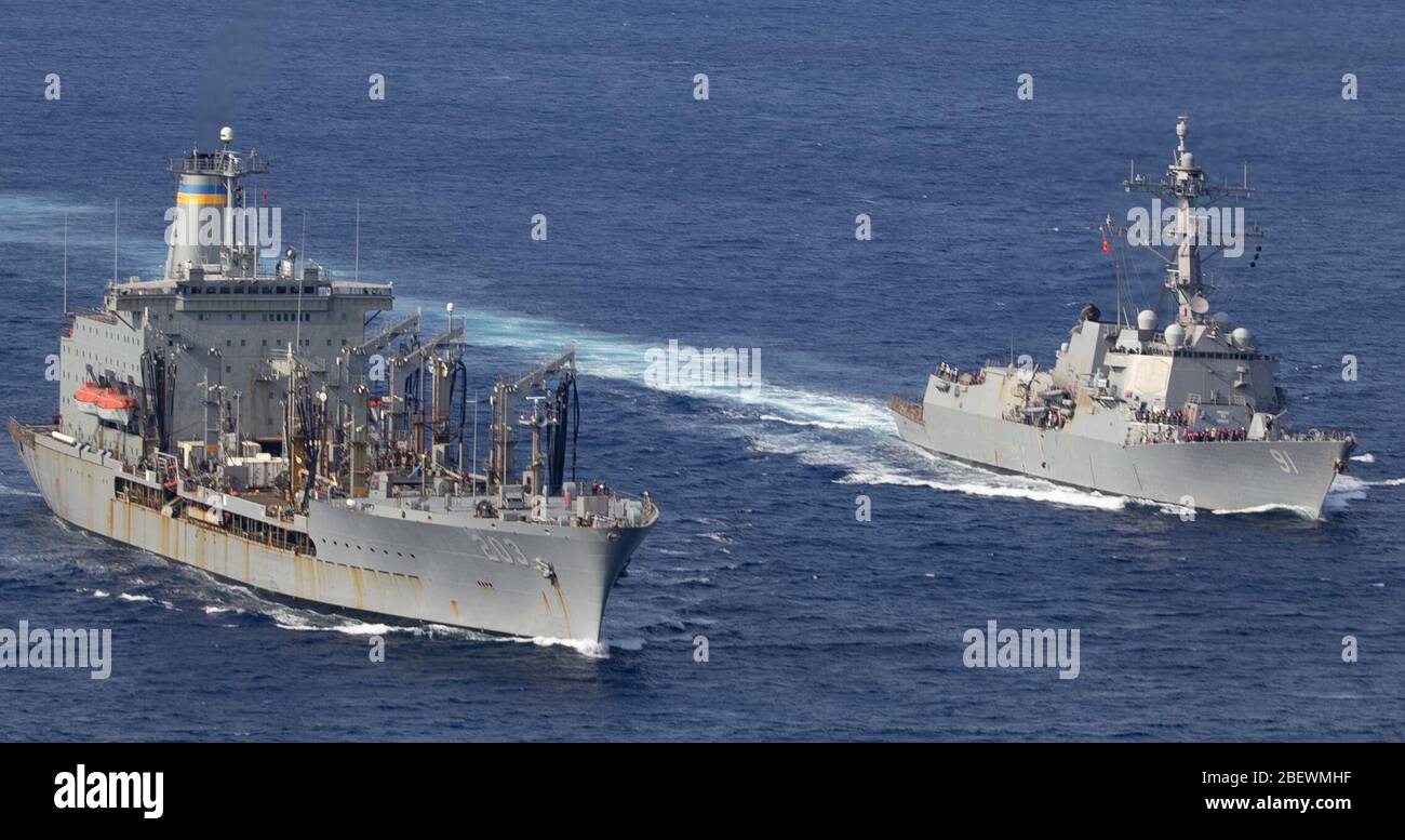PACIFIC OCEAN (April 8, 2020) U.S. Navy fleet replenishment oiler USNS Laramie (T-AO 203), left, steams beside the Arleigh Burke-class guided-missile destroyer USS Pinckney (DDG 91) before a replenishment-at-sea. Pinckney is deployed to the U.S. Southern Command area of responsibility to support Joint Interagency Task Force South’s mission, which includes counter illicit drug trafficking in the Caribbean and Eastern Pacific. (U.S. Navy photo by Mass Communication Specialist 3rd Class Erick A. Parsons) Stock Photo
