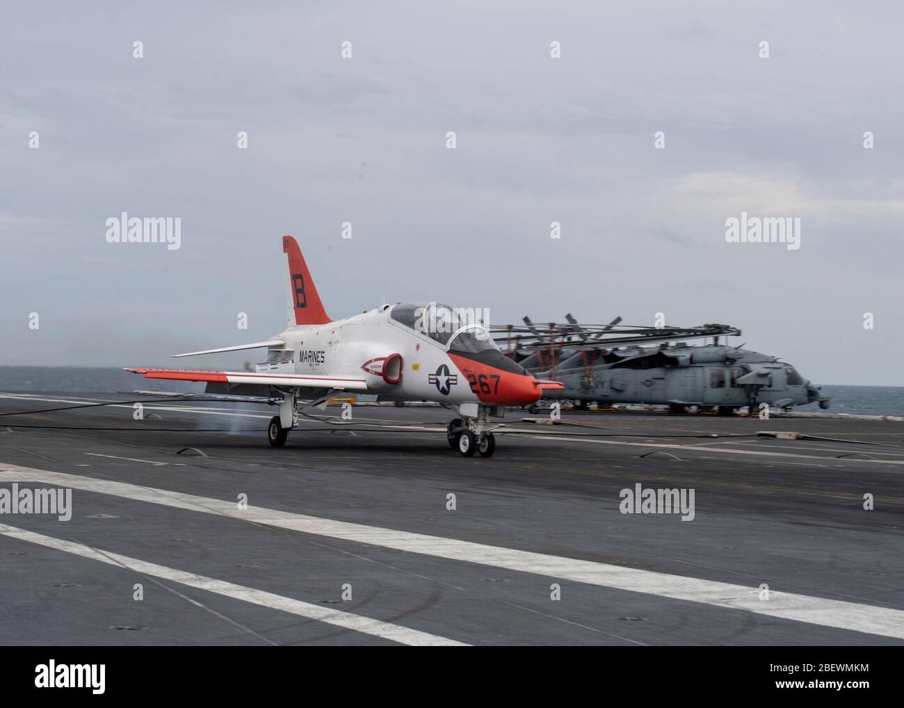 Lt. j.g. Cade Warlick lands a T-45C Goshawk, attached to Training Air Wing (TAW) 2, on USS Gerald R. Ford's (CVN 78) flight deck marking the 2,000 trap on Ford's advanced arresting gear (AAG) April 8, 2020. Ford is underway in the Atlantic Ocean conducting carrier qualifications. (U.S. Navy photo by Mass Communication Specialist Seaman Apprentice Conner Foy) Stock Photo