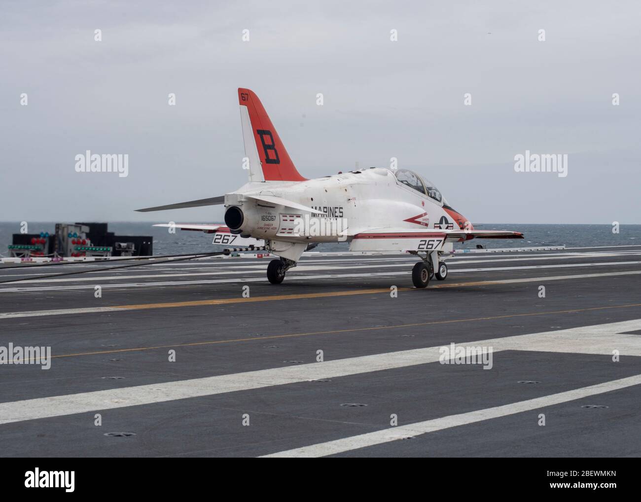 Lt. j.g. Cade Warlick lands a T-45C Goshawk, attached to Training Air Wing (TAW) 2, on USS Gerald R. Ford's (CVN 78) flight deck marking the 2,000 trap on Ford's advanced arresting gear (AAG) April 8, 2020. Ford is underway in the Atlantic Ocean conducting carrier qualifications. (U.S. Navy photo by Mass Communication Specialist Seaman Apprentice Conner Foy) Stock Photo