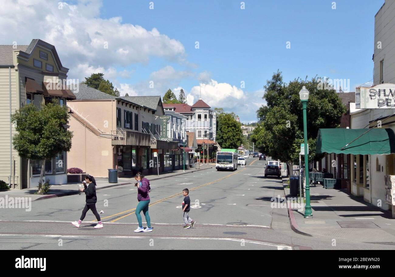 view of family crossing street in  downtown larkspur in marin county california Stock Photo