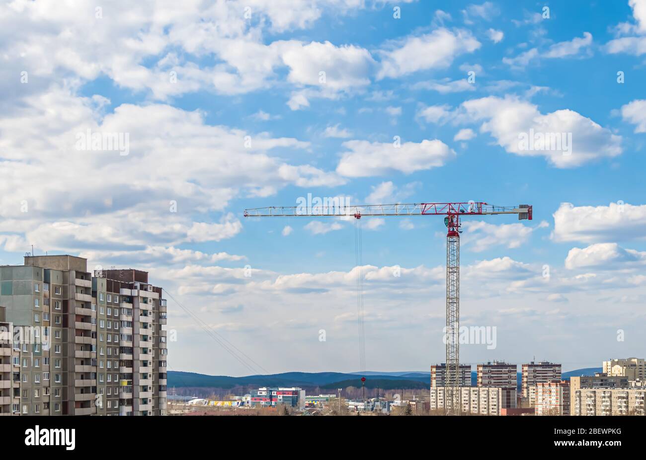 construction crane on a sky background, clouds Stock Photo - Alamy